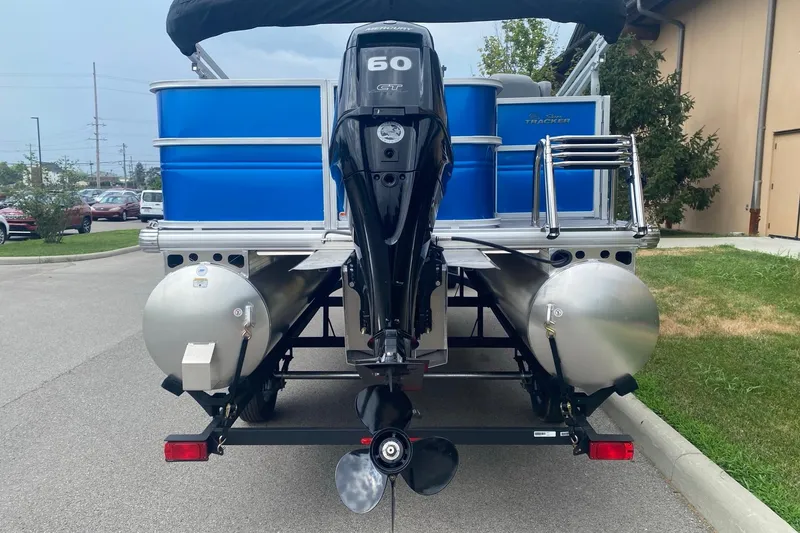 Slide: The Image of 2026 Sun Tracker Party Barge 18 DLX pontoon boat with 60 HP engine, rear view. - 3