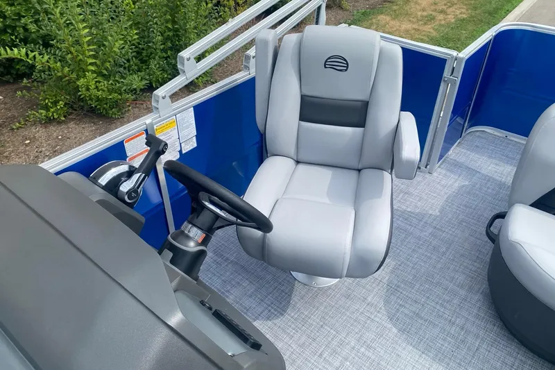Slide: The Image of Captain's chair on 2026 Sun Tracker Party Barge 18 DLX pontoon boat, featuring sleek design. - 8
