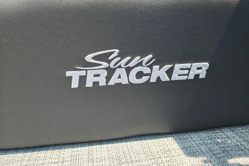 Slide: The Image of Sun Tracker logo on 2026 Party Barge 20 DLX boat seat. - 28