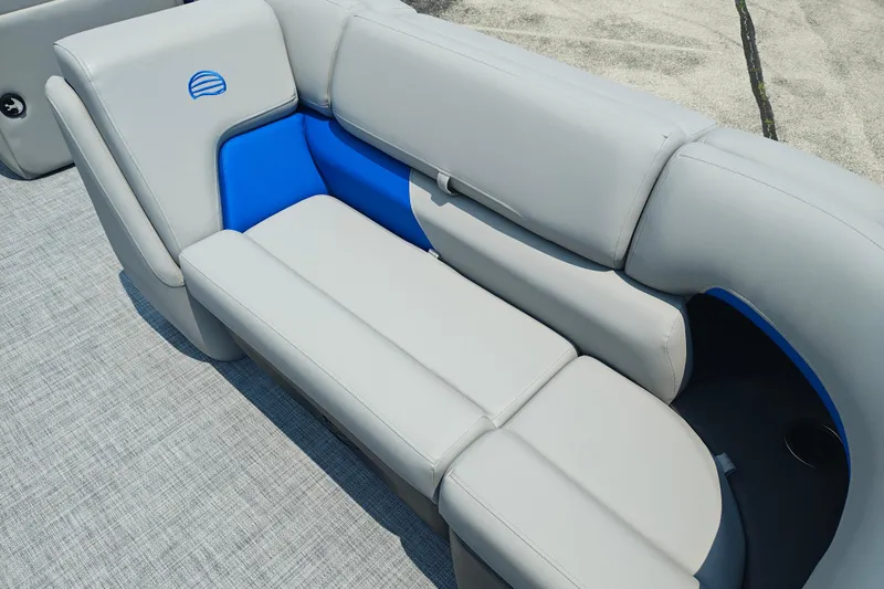 Slide: The Image of 2026 Sun Tracker Party Barge 20 DLX, featuring sleek gray and blue seating. - 7