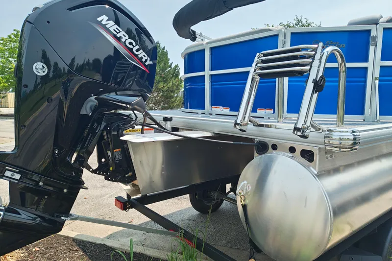 Slide: The Image of 2026 Sun Tracker Party Barge 20 DLX with Mercury outboard motor and ladder. - 4