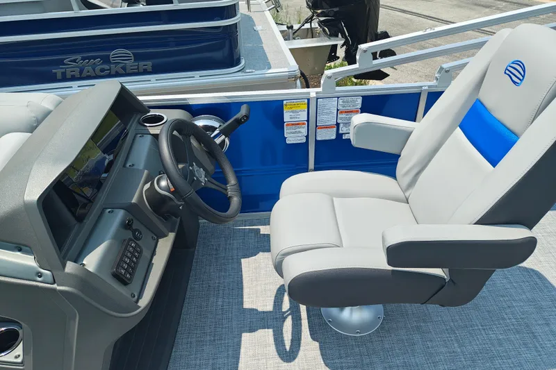 Slide: The Image of Captain's chair and helm of 2026 Sun Tracker Party Barge 20 DLX pontoon boat. - 13