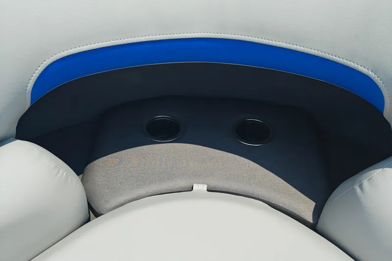 Slide: The Image of 2026 Sun Tracker Party Barge 20 DLX seating with cup holders and blue accent. - 12