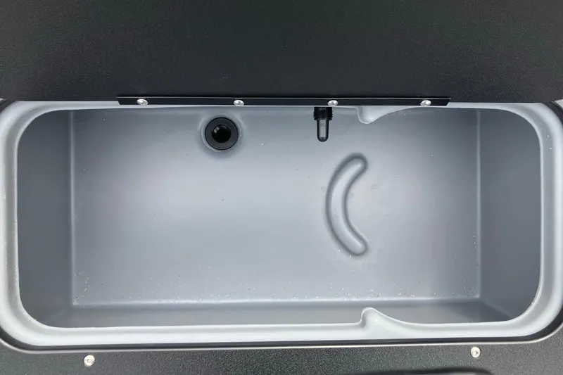 Slide: The Image of Livewell compartment of 2026 Sun Tracker SportFish 20 DLX boat, featuring a sleek design. - 13