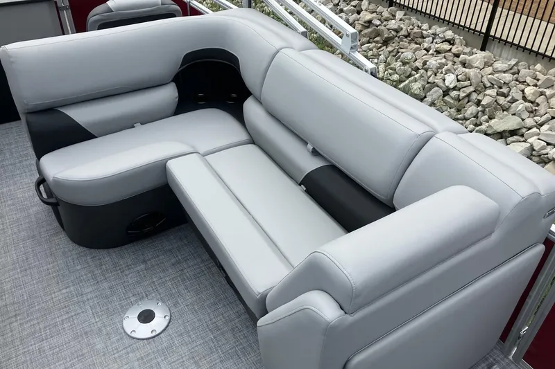 Slide: The Image of 2026 Sun Tracker SportFish 20 DLX boat interior with gray cushioned seating. - 10