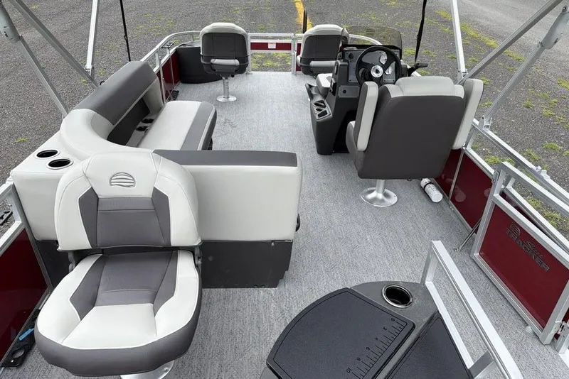 Slide: The Image of 2026 Sun Tracker Bass Buggy 18 DLX interior with seating and steering console. - 7
