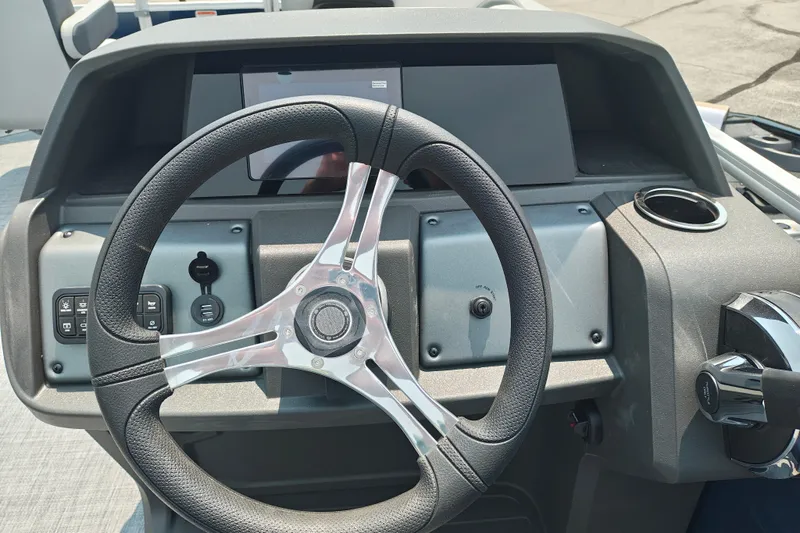 Slide: The Image of Steering console of 2026 Sun Tracker SportFish 20 DLX boat with modern controls. - 17