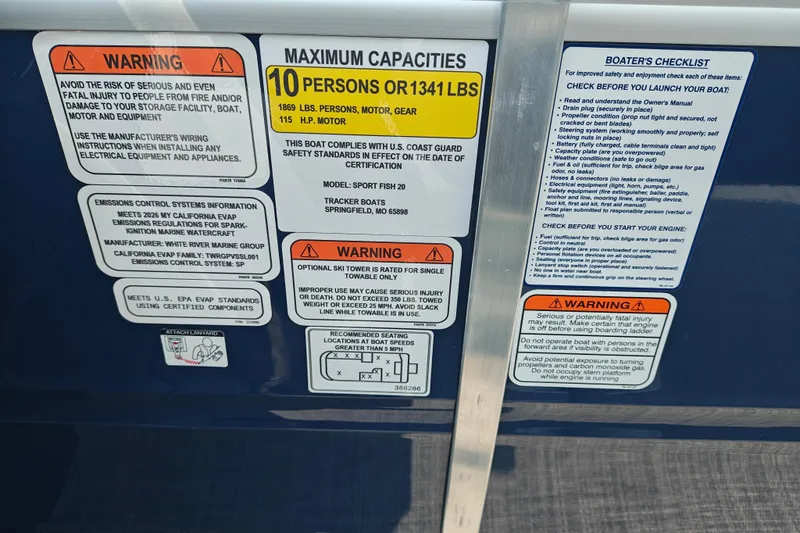 Slide: The Image of 2026 Sun Tracker SportFish 20 DLX safety and capacity warnings, including maximum load and boater's checklist. - 19