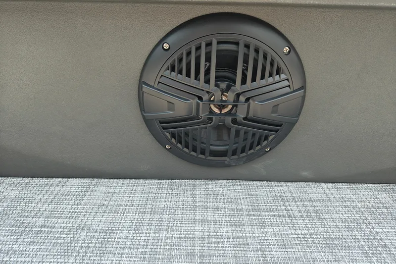 Slide: The Image of Speaker on 2026 Sun Tracker SportFish 20 DLX boat, featuring sleek black grille design. - 28