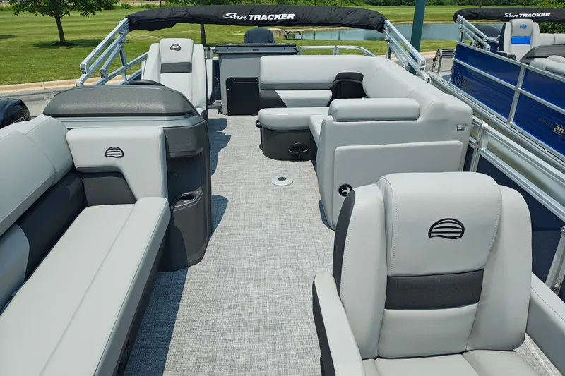 Slide: The Image of 2026 Sun Tracker SportFish 20 DLX pontoon boat interior with plush seating and modern design. - 7