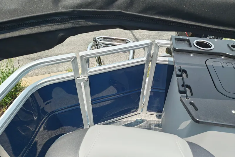 Slide: The Image of 2026 Sun Tracker SportFish 20 DLX boat interior with seating and fishing station. - 22