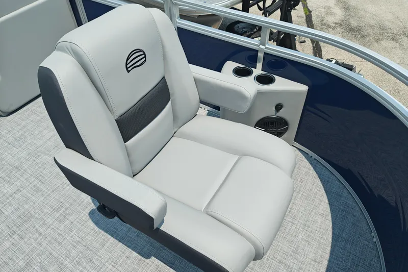 Slide: The Image of Luxurious seating on 2026 Sun Tracker SportFish 20 DLX pontoon boat, featuring cup holders and speaker. - 10