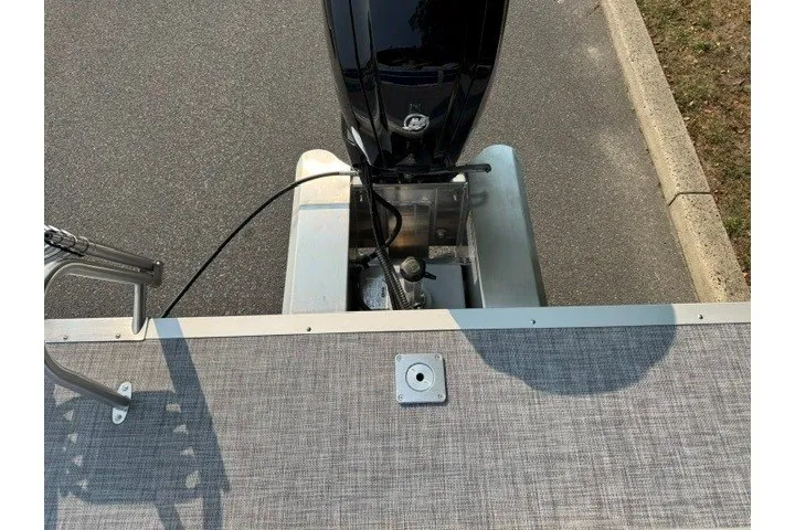 Slide: The Image of 2026 Sun Tracker Party Barge 20 DLX pontoon boat with outboard motor, rear view. - 15