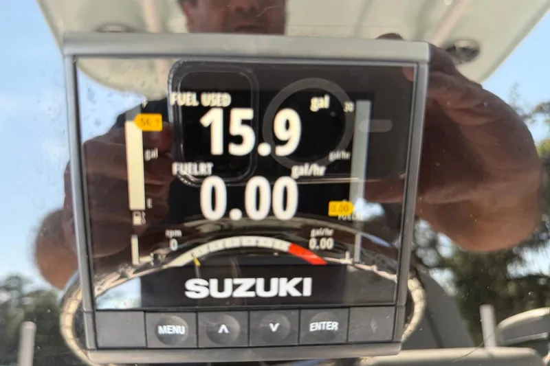 Slide: The Image of Suzuki display showing fuel usage on 2021 Sea Pro 248 Bay boat. - 12