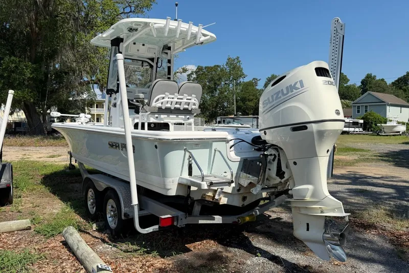 Slide: The Image of 2021 Sea Pro 248 Bay boat with Suzuki outboard motor on trailer. - 2