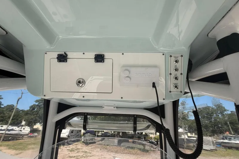 Slide: The Image of 2021 Sea Pro 248 Bay boat console with Simrad electronics and accessory controls. - 19