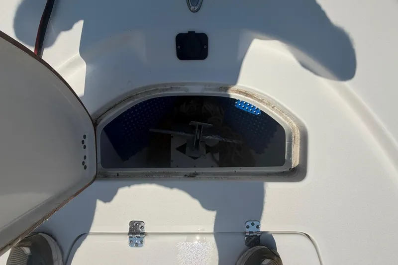 Slide: The Image of Open storage compartment on 2021 Sea Pro 248 Bay boat deck. - 37