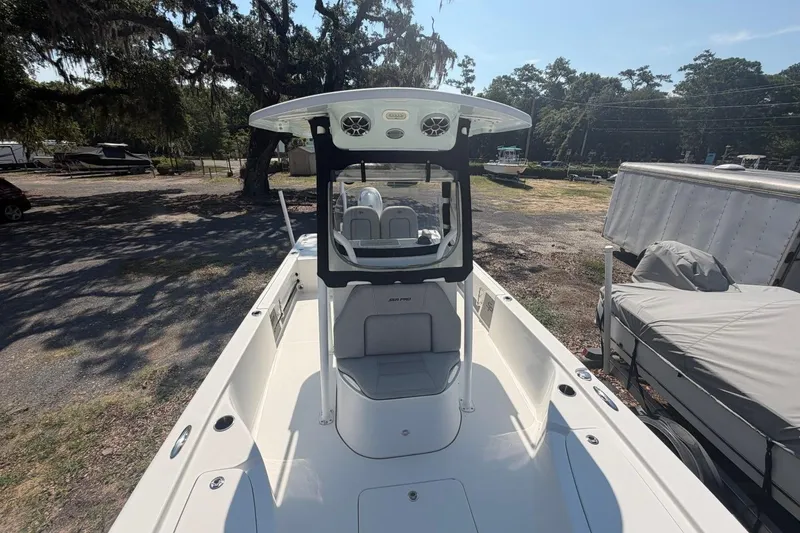 Slide: The Image of 2021 Sea Pro 248 Bay boat with T-top and spacious deck in outdoor setting. - 38