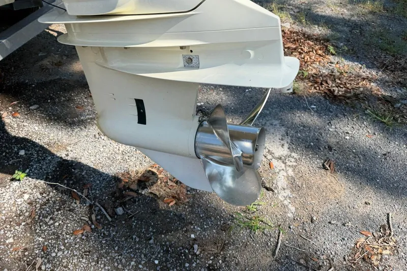 Slide: The Image of Propeller of a 2021 Sea Pro 248 Bay boat on gravel surface. - 6
