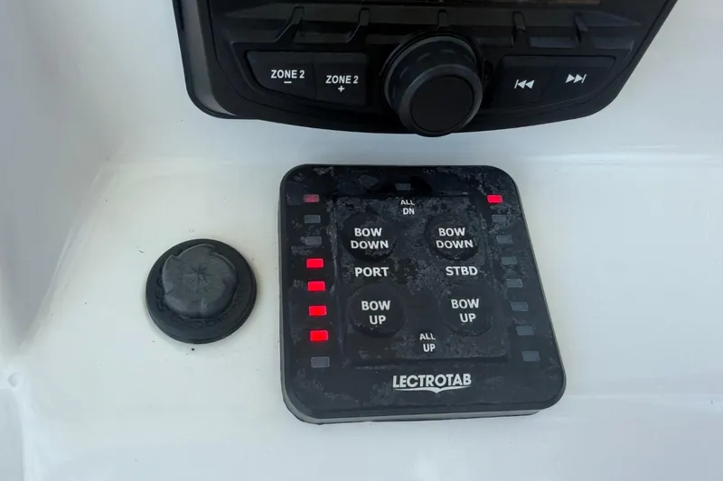 Slide: The Image of Control panel of a 2021 Sea Pro 248 Bay boat with Lectrotab trim tab system. - 9