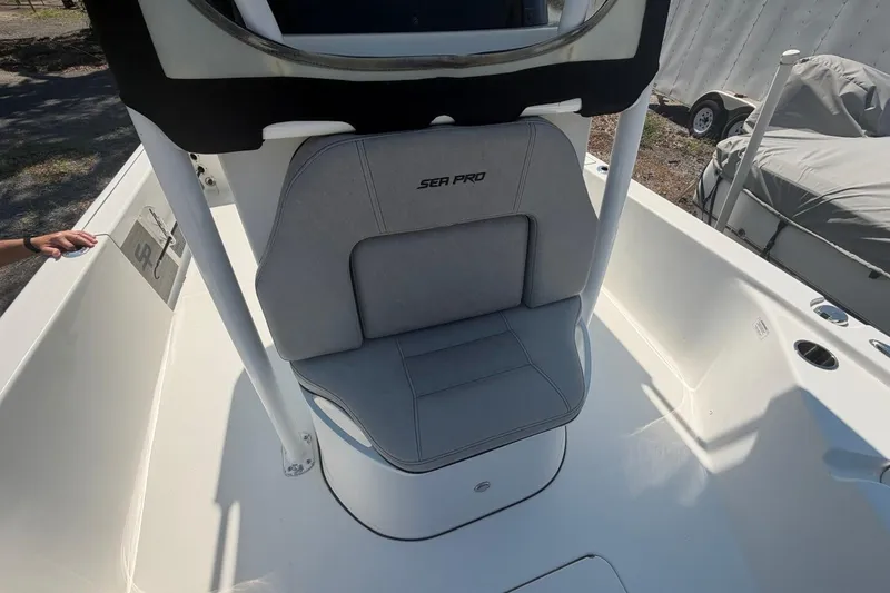 Slide: The Image of 2021 Sea Pro 248 Bay boat seat with gray upholstery and console. - 39