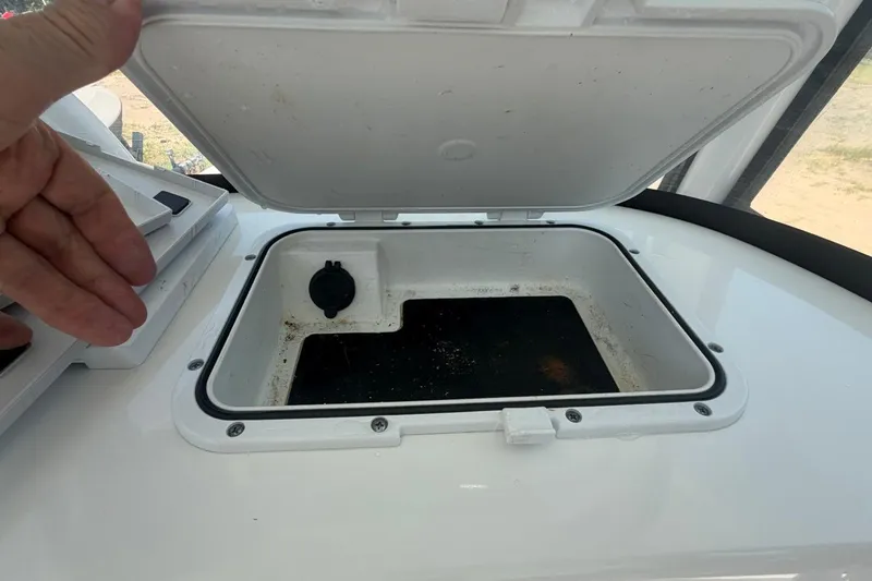 Slide: The Image of Open storage compartment on 2021 Sea Pro 248 Bay boat. - 20