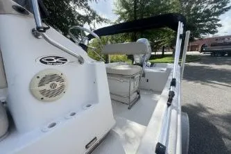 Slide: The Image of 2014 Carolina Skiff JVX18CC boat interior with steering console and seating. - 8