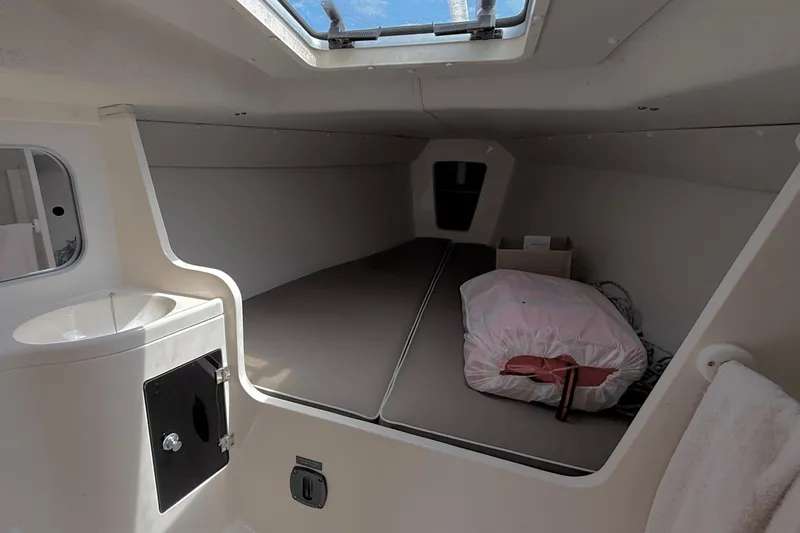 Slide: The Image of Interior cabin of a 2006 J Boats J/100 sailboat with a skylight and bedding. - 22