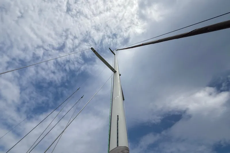 Slide: The Image of Mast of 2006 J Boats J/100 sailboat against a cloudy sky. - 10