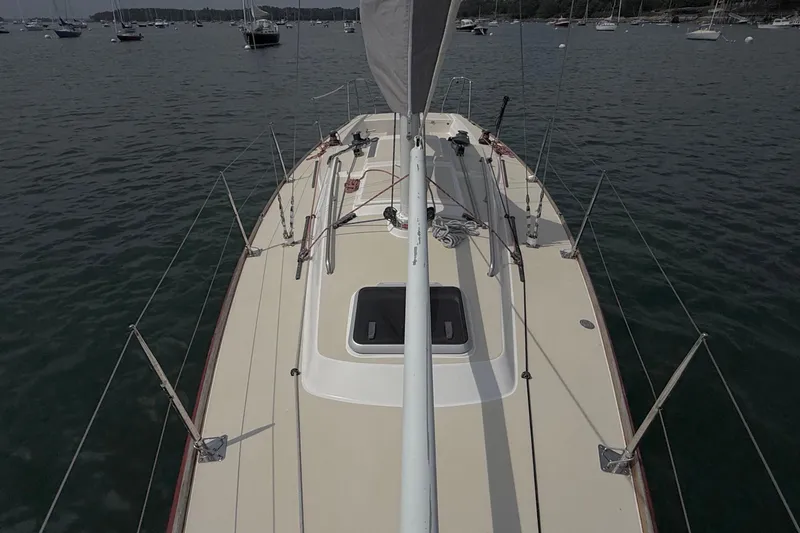 Slide: The Image of 2006 J Boats J/100 sailboat deck view on calm water. - 15