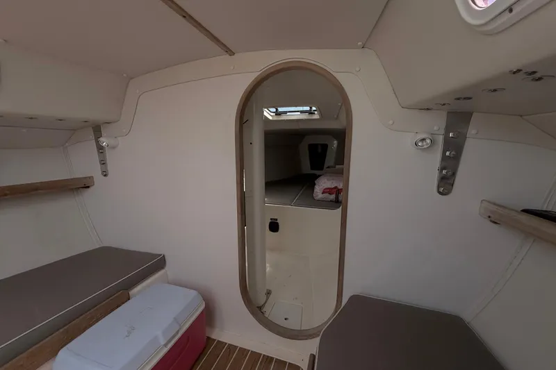 Slide: The Image of Interior of a 2006 J Boats J/100 sailboat, featuring a cozy cabin space. - 21