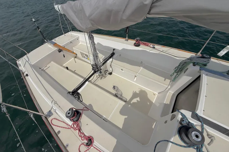 Slide: The Image of 2006 J Boats J/100 sailboat cockpit with rigging and winches on open water. - 3