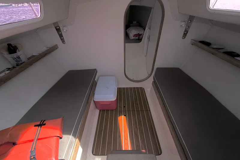Slide: The Image of Interior of 2006 J Boats J/100 sailboat with seating, cooler, and life jacket. - 20