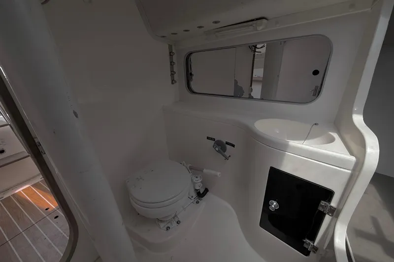 Slide: The Image of Interior of 2006 J Boats J/100 yacht bathroom with toilet and sink. - 23
