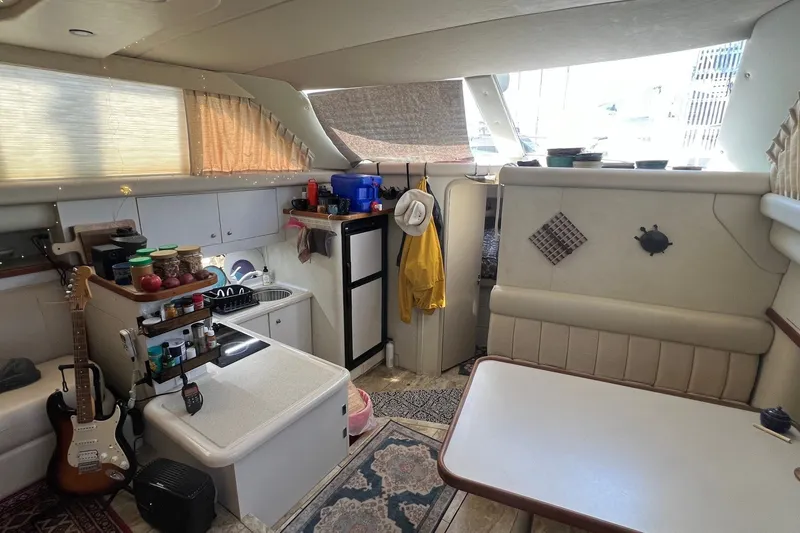 Slide: The Image of Interior of 1998 Cruisers Yachts 3650 Aft Cabin with kitchen and seating area. - 32