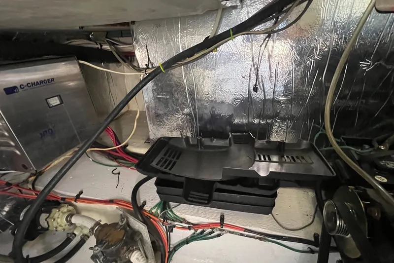 Slide: The Image of Engine room of 1998 Cruisers Yachts 3650 Aft Cabin with wiring and C-Charger. - 26