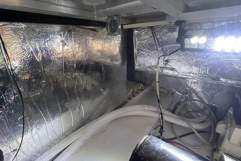 Slide: The Image of Engine room of 1998 Cruisers Yachts 3650 Aft Cabin with insulation and lighting. - 30