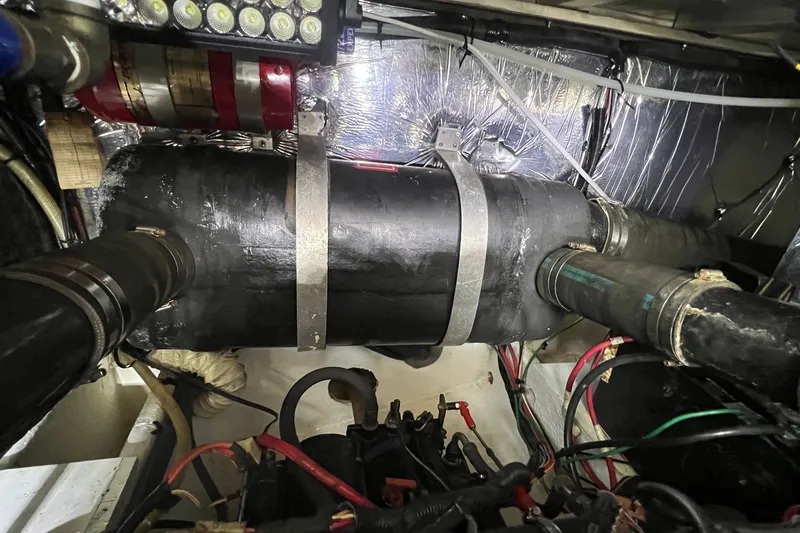 Slide: The Image of Engine room of 1998 Cruisers Yachts 3650 Aft Cabin with visible components and wiring. - 22
