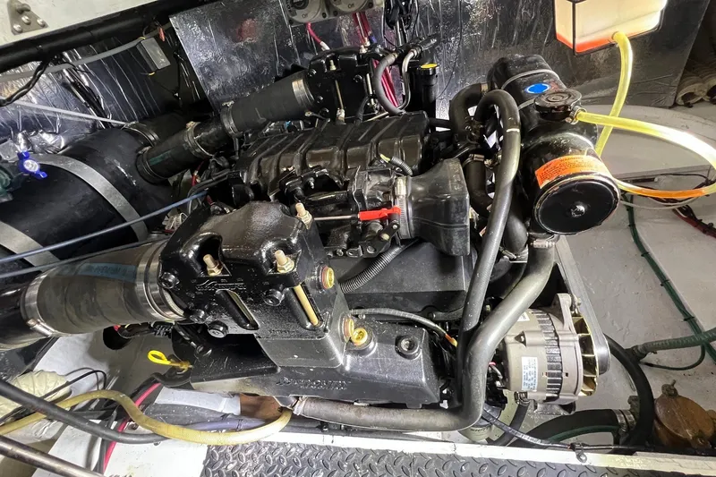 Slide: The Image of Engine compartment of a 1998 Cruisers Yachts 3650 Aft Cabin, showcasing mechanical components. - 21