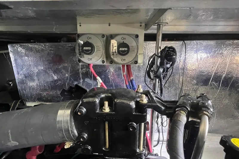 Slide: The Image of Engine room of 1998 Cruisers Yachts 3650 Aft Cabin with battery switches and wiring. - 28