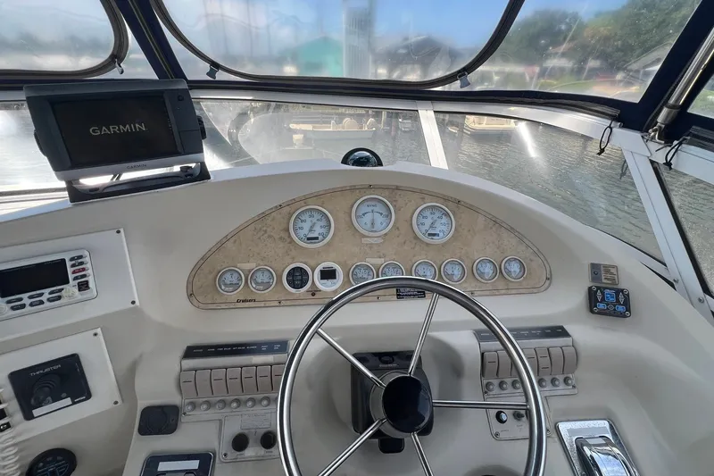 Slide: The Image of 1998 Cruisers Yachts 3650 Aft Cabin helm with Garmin navigation system and instrument panel. - 8