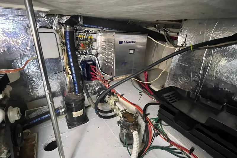Slide: The Image of Engine room of 1998 Cruisers Yachts 3650 Aft Cabin with wiring and equipment. - 27