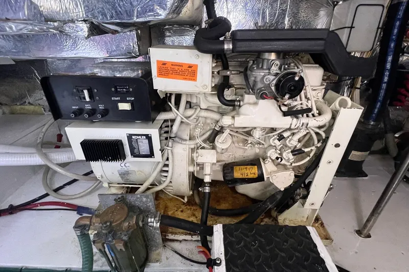 Slide: The Image of Engine room of 1998 Cruisers Yachts 3650 Aft Cabin with Kohler generator. - 24