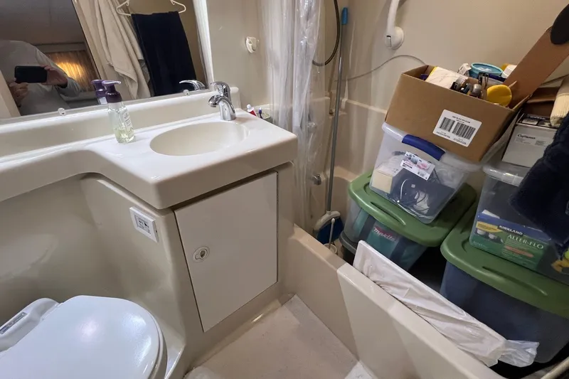 Slide: The Image of Bathroom interior of a 1998 Cruisers Yachts 3650 Aft Cabin with storage boxes. - 43