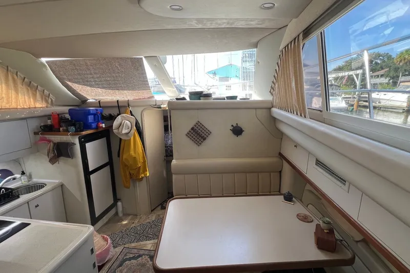 Slide: The Image of 1998 Cruisers Yachts 3650 Aft Cabin interior with kitchenette and dining area. - 31