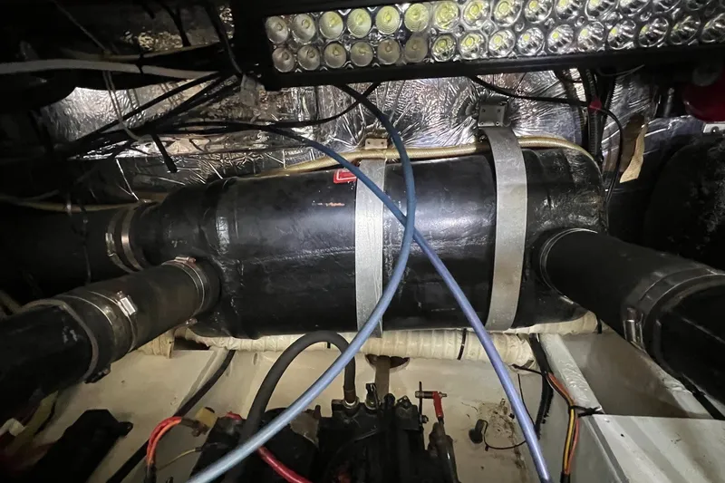 Slide: The Image of Engine compartment of 1998 Cruisers Yachts 3650 Aft Cabin with visible components and wiring. - 25