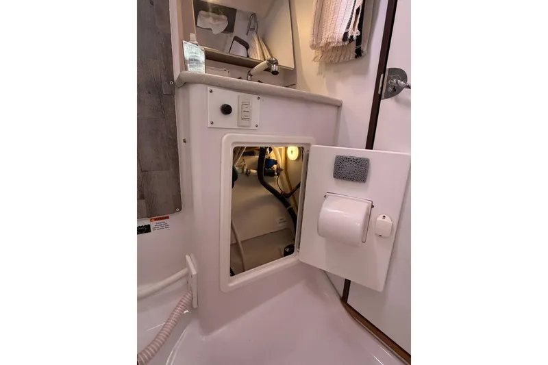 Slide: The Image of Interior view of a 2015 Catalina 445 sailboat showing a utility compartment. - 49