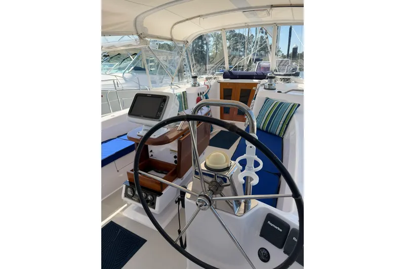 Slide: The Image of Cockpit of 2015 Catalina 445 sailboat with steering wheel and navigation equipment. - 8