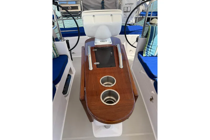 Slide: The Image of Cockpit of 2015 Catalina 445 sailboat with wooden table and cup holders. - 17