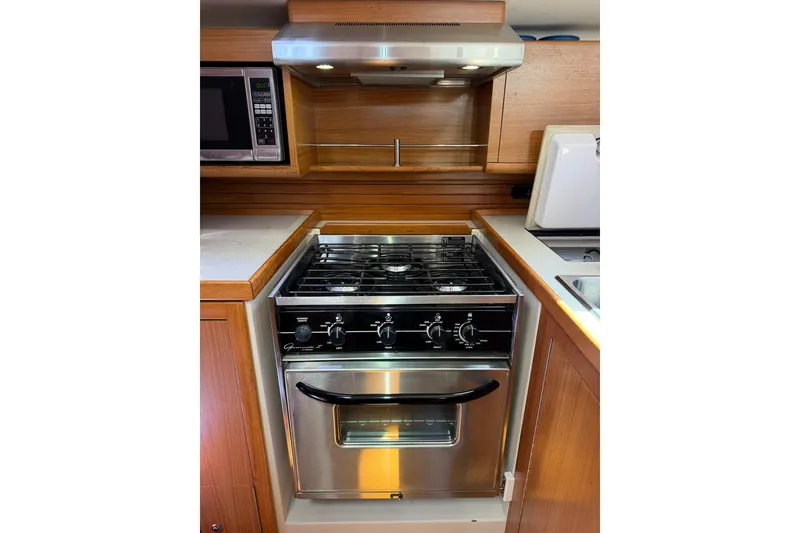 Slide: The Image of Modern kitchen in 2015 Catalina 445 yacht with stainless steel stove and microwave. - 53